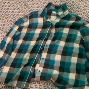 A blue , white and black plaid shirt